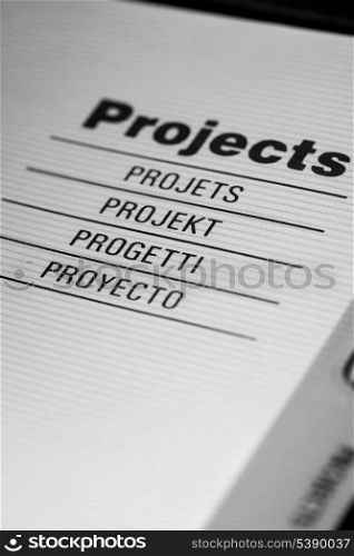 The word projects in different languages closeup in organizer