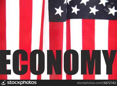 the word &rsquo;economy&rsquo; on an American flag