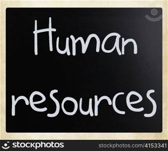 The word &rsquo;Human resources&rsquo; handwritten with white chalk on a blackboard