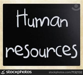 The word &rsquo;Human resources&rsquo; handwritten with white chalk on a blackboard