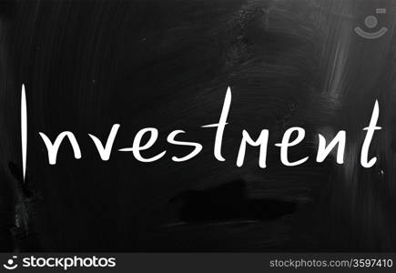 The word &rsquo;Investment&rsquo; handwritten with white chalk on a blackboard