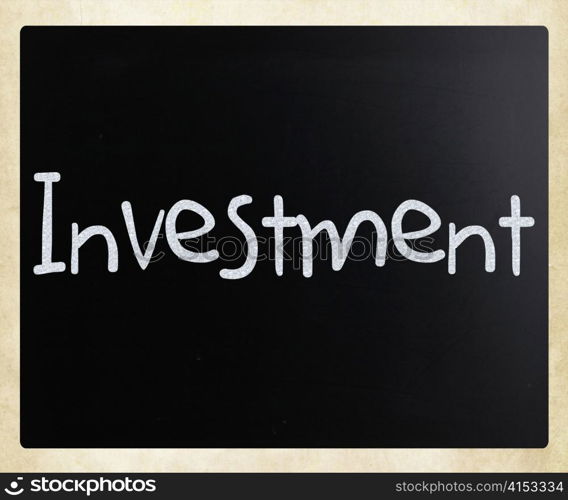 The word &rsquo;Investment&rsquo; handwritten with white chalk on a blackboard