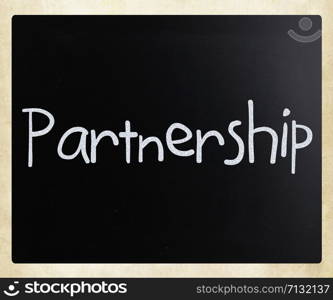 The word &rsquo;Partnership&rsquo; handwritten with white chalk on a blackboard