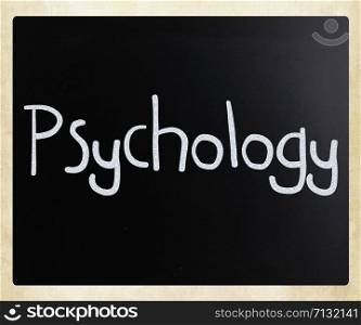 The word &rsquo;Psychology&rsquo; handwritten with white chalk on a blackboard