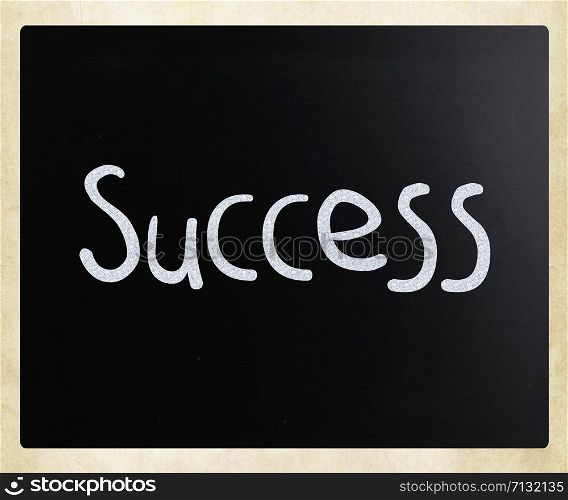 The word &rsquo;Success&rsquo; handwritten with white chalk on a blackboard