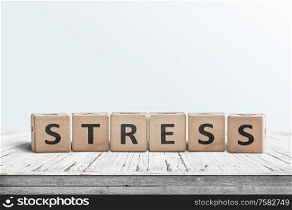 The word stress on a sign made of wooden blocks in a bright room on a table
