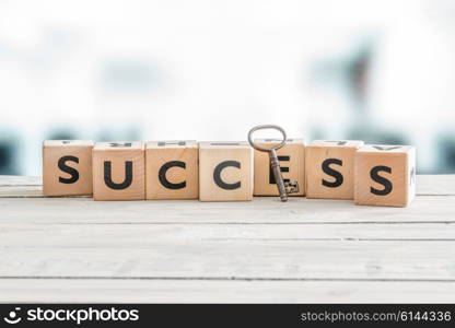 The word success with a metal key