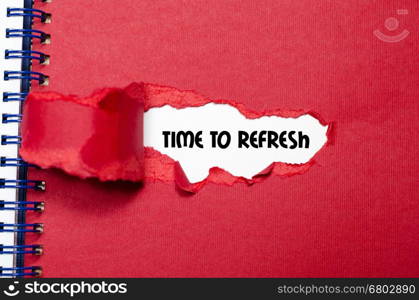 The word time to refresh appearing behind torn paper