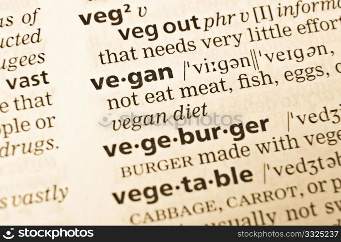 The word vegan in the old dictionary. Selective focus effect.