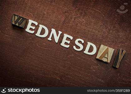 The word wednesday written on wooden background