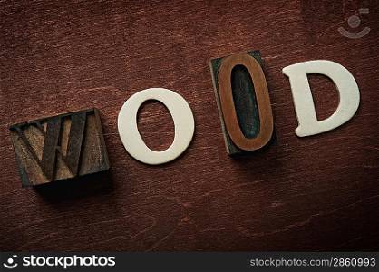 The word wood written on wooden background