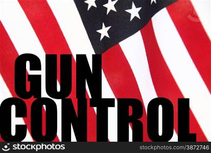 the words gun control on a USA flag background