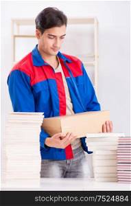 The worker in publishing house preparing book order. Worker in publishing house preparing book order