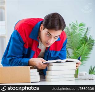 The worker in publishing house preparing book order. Worker in publishing house preparing book order