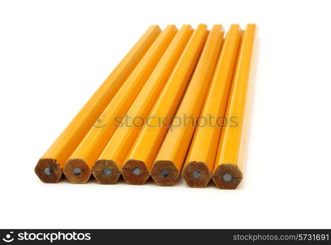 The yellow ground pencil lies is isolated on a snow-white background