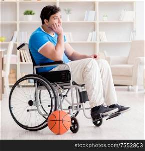The young basketball player on wheelchair recovering from injury. Young basketball player on wheelchair recovering from injury