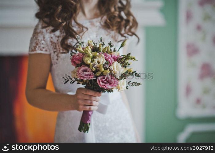 The young bride costs with a bunch of flowers.. Bunch of flowers in hands of the bride 2646.. Bunch of flowers in hands of the bride 2646.