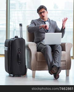 The young businessman in airport business lounge waiting for flight. Young businessman in airport business lounge waiting for flight