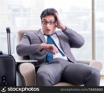 The young businessman in airport business lounge waiting for flight. Young businessman in airport business lounge waiting for flight