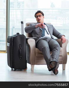 The young businessman in airport business lounge waiting for flight. Young businessman in airport business lounge waiting for flight