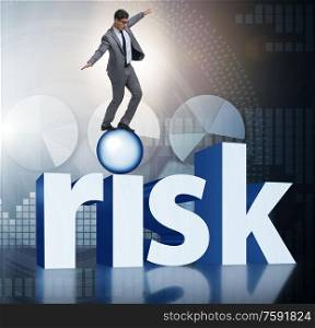 The young businessman in business risk and uncertainty concept. Young businessman in business risk and uncertainty concept
