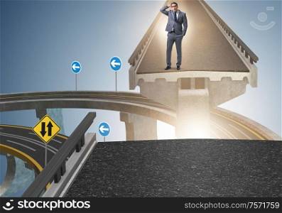 The young businessman in uncertainty concept with bridge. Young businessman in uncertainty concept with bridge