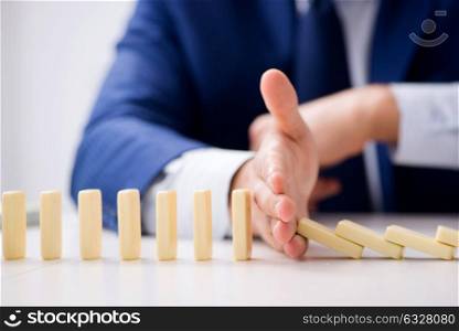 The young businessman playing with domino in office. Young businessman playing with domino in office
