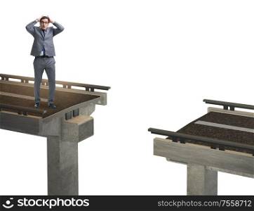 The young businessman with broken bridge isolated on white. Young businessman with broken bridge isolated on white