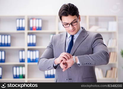 The young businessman working in the office. Young businessman working in the office