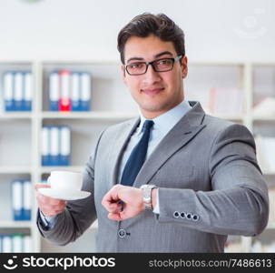 The young businessman working in the office. Young businessman working in the office