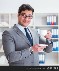 The young businessman working in the office. Young businessman working in the office