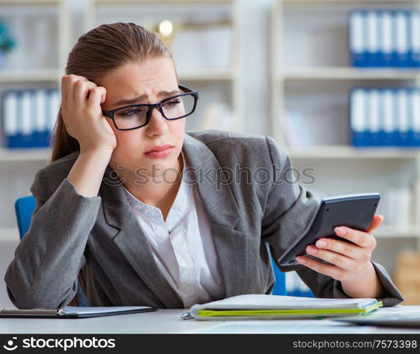 The young businesswoman accountant working in the office. Young businesswoman accountant working in the office