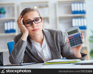 The young businesswoman accountant working in the office. Young businesswoman accountant working in the office