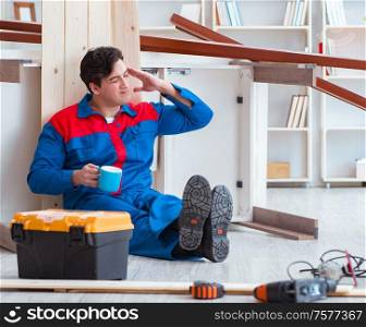 The young carpenter at work tired feeling not well. Young carpenter at work tired feeling not well