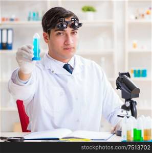 The young chemical scientist working in lab. Young chemical scientist working in lab