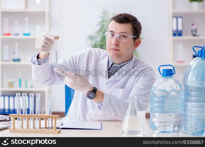 The young chemist student experimenting in lab. Young chemist student experimenting in lab