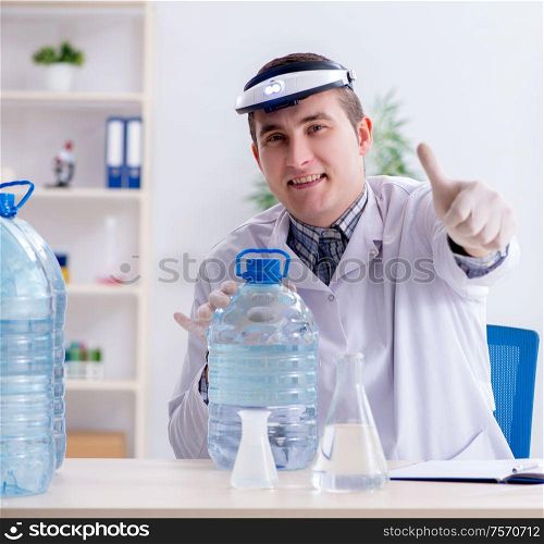 The young chemist student experimenting in lab. Young chemist student experimenting in lab