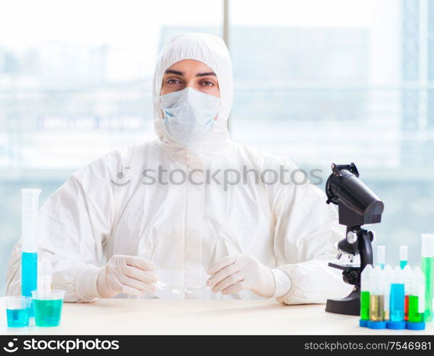 The young chemist student working in lab on chemicals. Young chemist student working in lab on chemicals