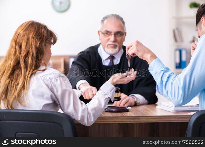 The young couple in the courthouse in divorce concept. Young couple in the courthouse in divorce concept