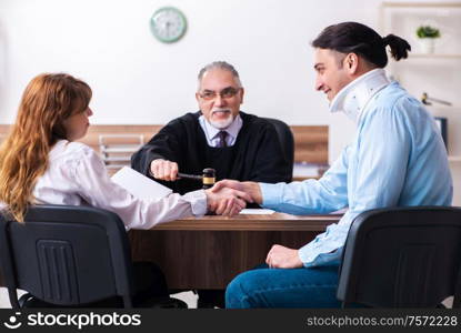 The young couple in the courthouse in divorce concept. Young couple in the courthouse in divorce concept