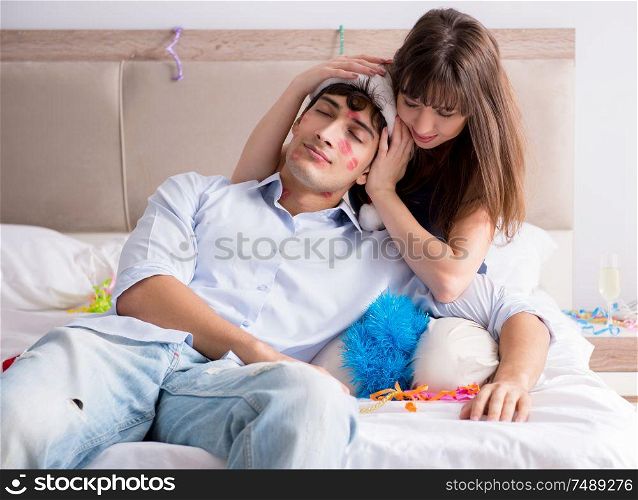 The young couple partying in the bed. Young couple partying in the bed