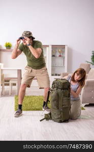 The young couple planning a trip to mountains. Young couple planning a trip to mountains