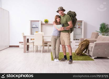 The young couple planning a trip to mountains. Young couple planning a trip to mountains