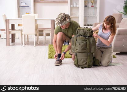 The young couple planning a trip to mountains. Young couple planning a trip to mountains