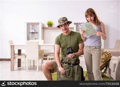 The young couple planning a trip to mountains. Young couple planning a trip to mountains