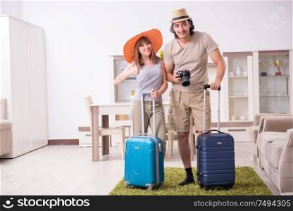 The young couple preparing for trip. Young couple preparing for trip