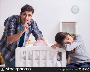 The young dad cannot stand baby crying. Young dad cannot stand baby crying