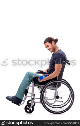 The young disabled man doing physical exercises isolated on white. Young disabled man doing physical exercises isolated on white