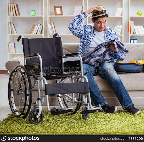 The young disabled man preparing for summer vacation. Young disabled man preparing for summer vacation