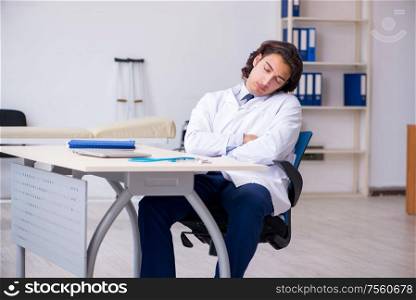 The young doctor being tired after night shift. Young doctor being tired after night shift